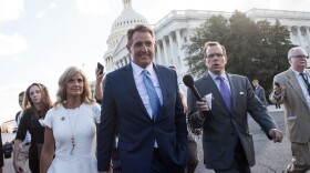 Sen. Jeff Flake (R-Ariz.) and his wife Cheryl Flake leave the U.S. Capitol as they are trailed by reporters, Oct. 24, 2017 in Washington, D.C. Flake announced that he will not be seeking re-election and he will leave the Senate after his term ends in 2018. (Drew Angerer/Getty Images)