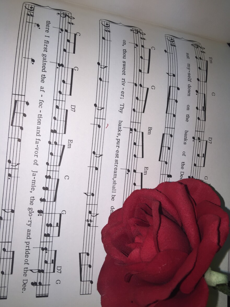 Sheet music with a rose