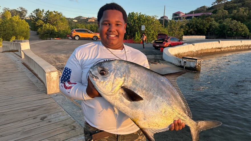 Jadriel “JJ” John holds a pompano he caught off the pier at Altona Lagoon using a handline. This photo is among those posted to John’s social media accounts in April 2025.
