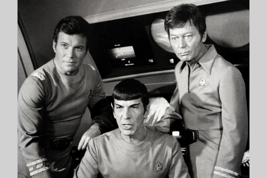 William Shatner, Leonard Nimoy, and DeForest Kelley appear together in the film Star Trek. Shatner played the role of Captain James T. Kirk, Nimoy appeared as Mr. Spock, and Kelley as Dr. Leonard "Bones" McCoy. They were all inhabitants of the Starship Enterprise.