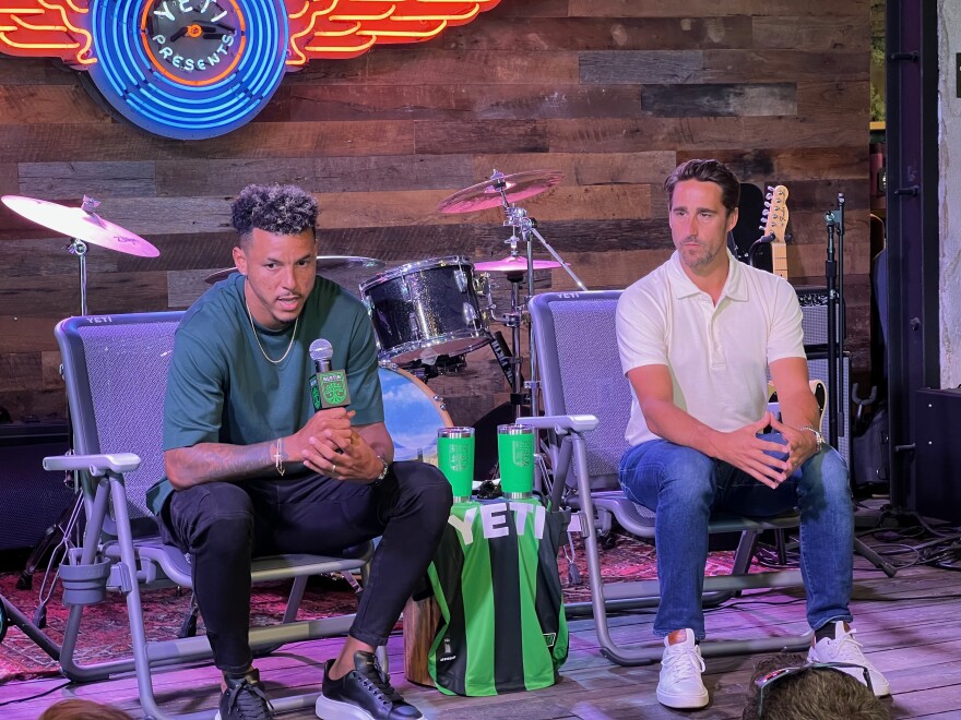  Austin FC defender Julio Cascante and head coach Josh Wolff speak at a news conference Thursday ahead of the MLS Western Conference final match between Austin and LAFC. They spoke downtown at the Yeti store, Austin's primary uniform sponsor. Jimmy Maas/KUT