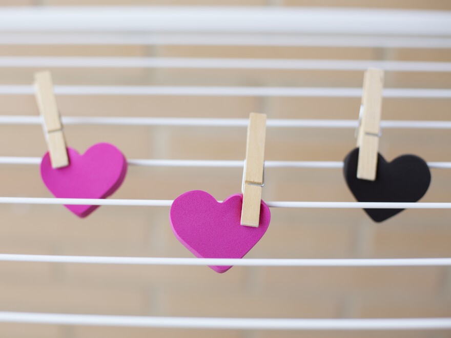 three hearts held on clothes pins