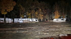 Floodwaters surround trailers at the Fun Valley Family Resort campground and RV part in South Fork, Colo., early Friday, Oct. 23, 2026.
