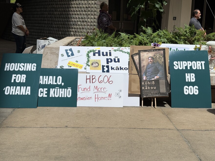 Signs read in support for House Bill 606.