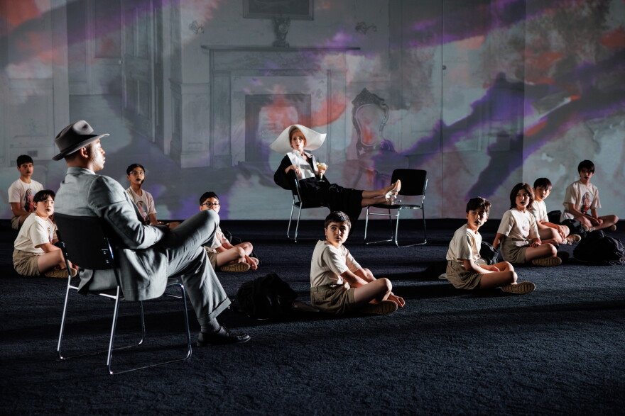 Branden Lindsay (as Dr. Cukrowicz), Tina Benko (as Mrs. Venable), and singers from the Young People's Chorus in the operatic production of 'Suddenly Last Summer.'