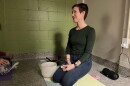 Ashley Krstulovich teaches yoga and meditation to a group of women at the Helping Hands of Springfield shelter.