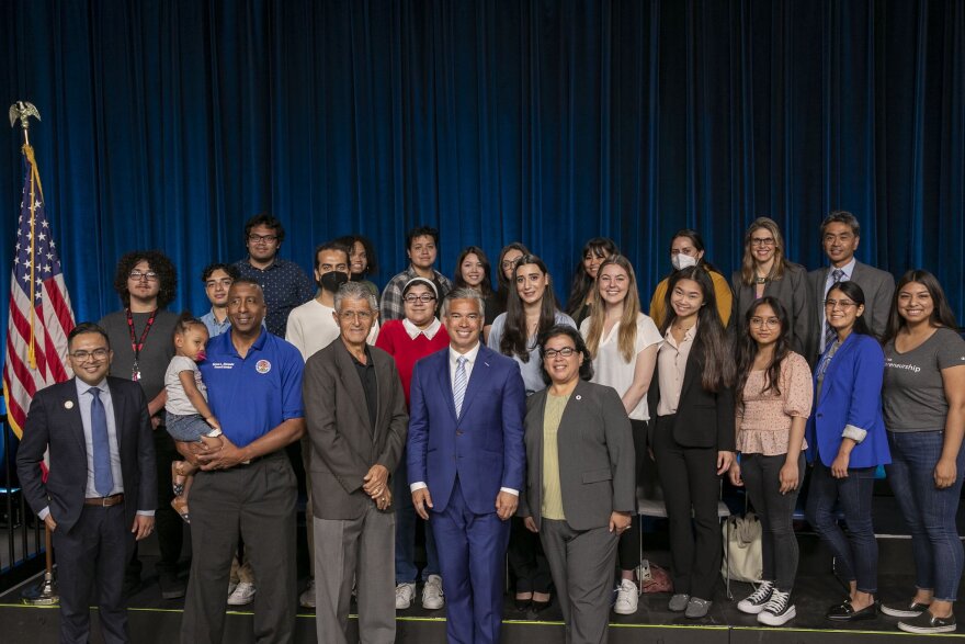 California Attorney General Rob Bonta posing with attendees of a student forum held at San Bernardino Valley College on May 31, 2022.