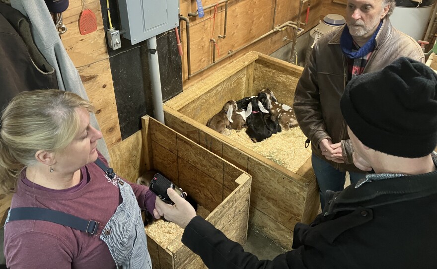 Laurie Cuevas of Thomas Farm & Dairy in Sunderland, Mass. (left), Phil Korman of CISA (top) and NEPM's Monte Belmonte gather near the cutest of kids.