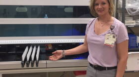 Melissa Randolph, cytopathology supervisor at Indiana University Health, shows a new piece of equipment in the lab.