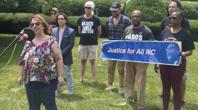 Rose Roby, with the Justice for All Party of North Carolina and a volunteer involving the Cornel West campaign, left, speaks at a news conference outside the Legislative Building in Raleigh, N.C., Monday, June 3, 2024, to discuss petition signature efforts by the group to qualify as an official political party in the state. News conference speakers supported making West the party's candidate for president on state ballots this fall. (AP Photo/Gary D. Robertson)