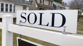 A sold sign hangs in front of a Brighton, New York house on Tuesday, February 21, 2023. (Ted Shaffrey/AP)