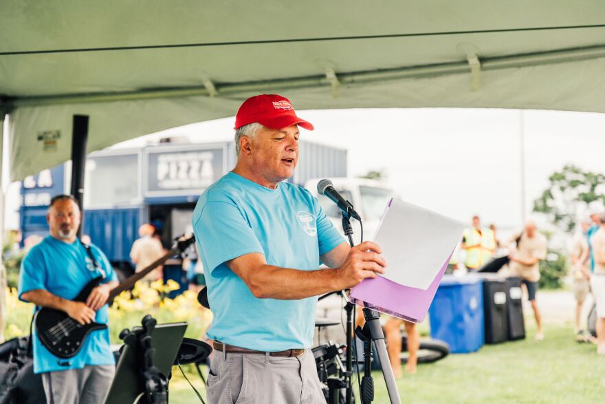 Topher Hamblett, Executive Director of Save the Bay, speaks at their 2024 swim event.
