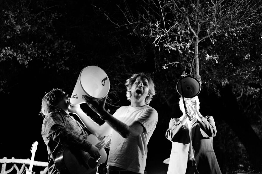 Erik Sanden, center, in concert with Buttercup.