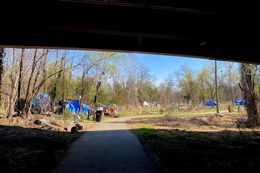 Looking south under Free Bridge at the roughly 26 residents living in tents along the river.