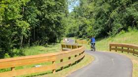 People ride along a bike trail in Fairfield. The city has secured grant funding to extend the Great Miami River Recreation Trail to Marsh Park.