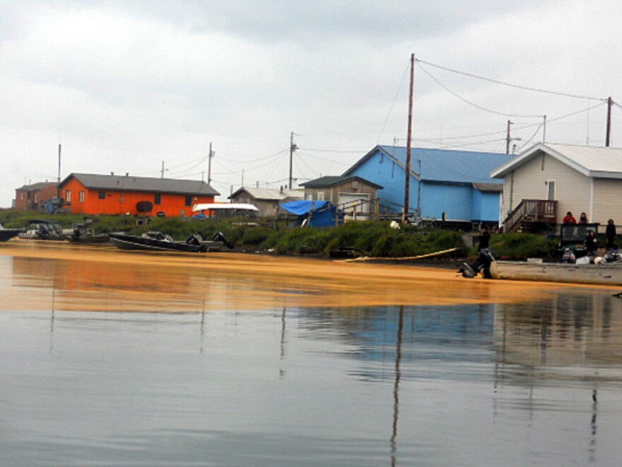 A photo taken on Aug. 3 shows an orange mass floating on the water at Kivalina, Alaska. Samples of the "goo" were sent to NOAA for analysis — and determined to be fungal spores, not microscopic eggs.