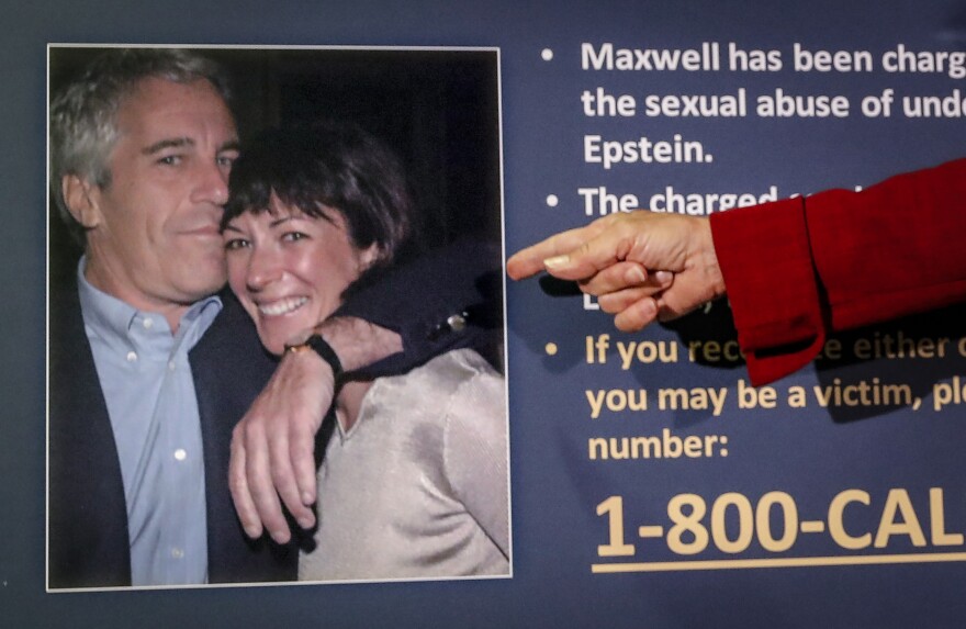 FILE - Audrey Strauss, acting U.S. attorney for the Southern District of New York, points to a photo of Jeffrey Epstein and Ghislaine Maxwell, during a news conference in New York on July 2, 2020. (AP Photo/John Minchillo, File)