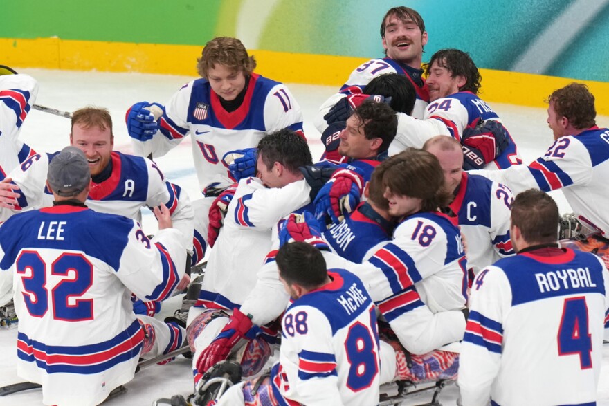 Tampa's Declan Farmer (assistant captain on left) and his U.S. teammates celebrate after winning the sled hockey gold-medal match against Canada at the 2026 Winter Paralympics, in Milan, Italy, Sunday, March 15, 2026.