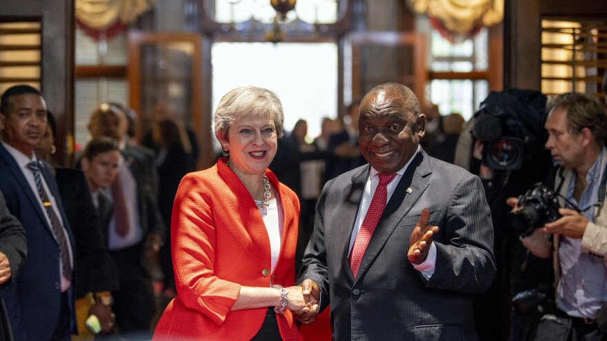 British Prime Minister Theresa May meets with South African President Cyril Ramaphosa in Cape Town, South Africa, during a three-nation visit to Africa. May has promised to boost Britain's investment in the continent.