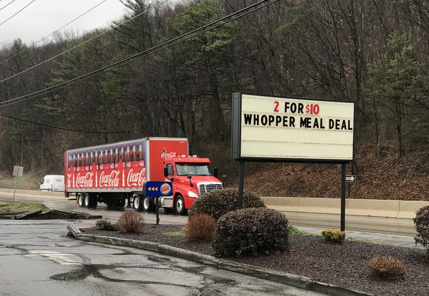 A Coca-Cola truck drives past a Burger King in Northumberland County, Pa. More than 40 percent of county residents have conditions that put them at risk of diabetes, and 14.2 percent of households are food-insecure.