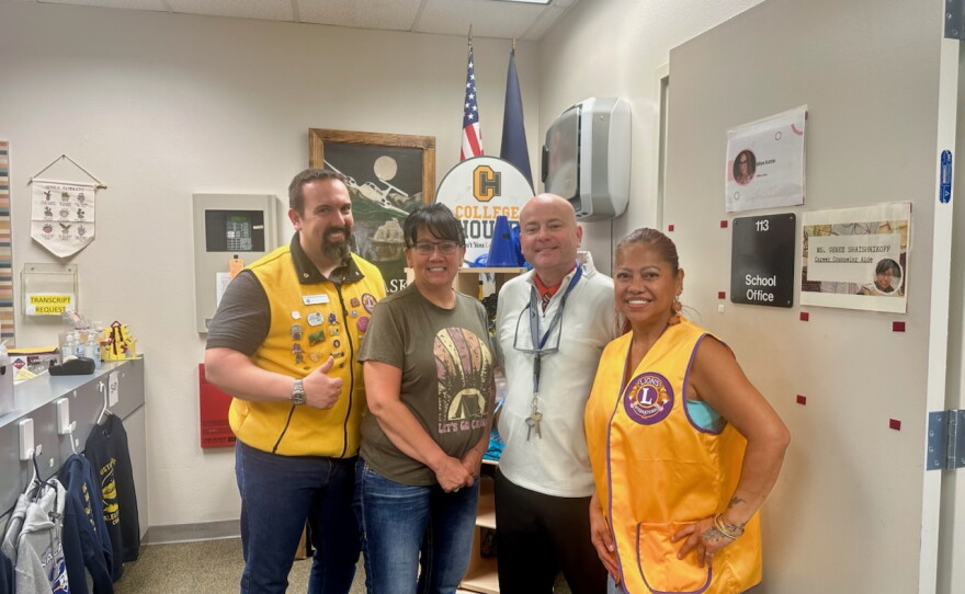 From left, optometrist Patrick Campaign, Genee Shaishnikoff, a career counselor aide with the Unalaska City School District, Superintendent Ryan Humphrey and Bernadette Oller Namasivayam of the Ballyhoo Lions Club at UCSD's school office in August 2026.