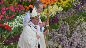 The sun competed with clouds in the sky, but the square was a riot of floral color in Rome, where chilly winter has postponed the blossoming of many flowers. The pope advised people to let love transform their lives, or as he put it, "let those desert places in our hearts bloom."