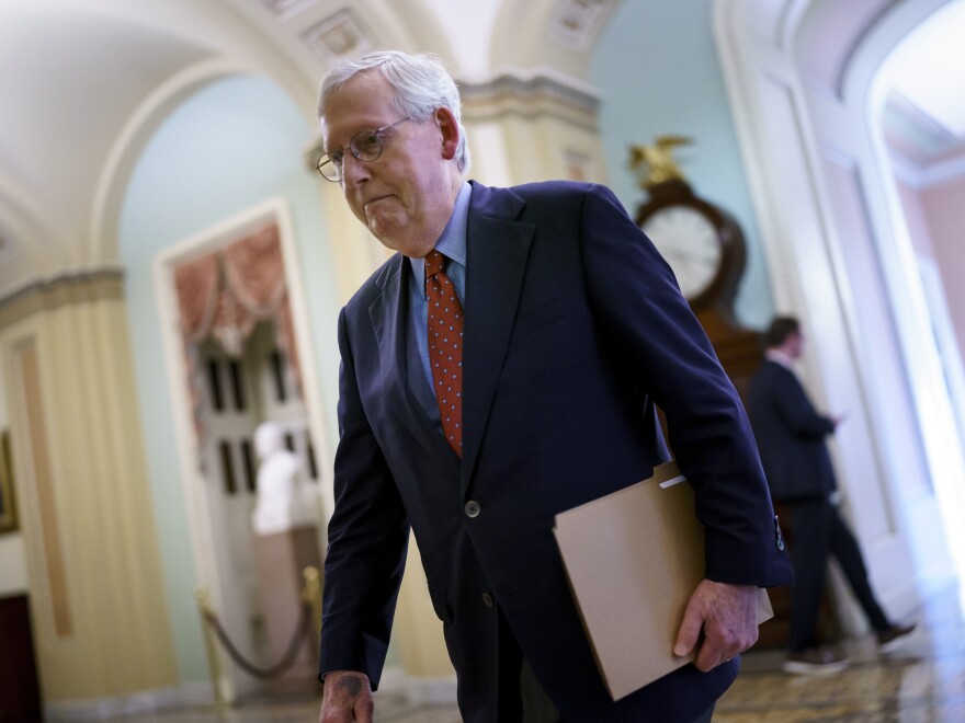 Senate Minority Leader Mitch McConnell, A Republican from Kentucky, walks to the chamber. 