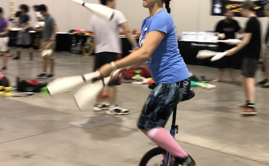 Erin Riley juggles on a unicycle on July 17, 2018 at the MassMutual Center.