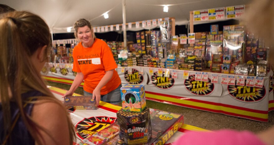 Cheryl Hooper sells TNT Fireworks from her stand near Route 66 and Westminster Road in Arcadia. 