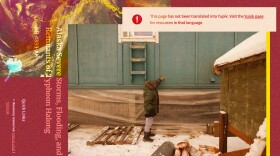 Walter Nelson, managed retreat coordinator, points out the high water mark during flooding last month when the remnants of Typhoon Halong hit Napakiak, Alaska.