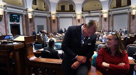 FRANKFORT, April 13, -- Speaker of the House David W. Osborne, R-Prospect (left), consults with House Majority Caucus Chair Suzanne Miles, R-Owensboro, in the House.