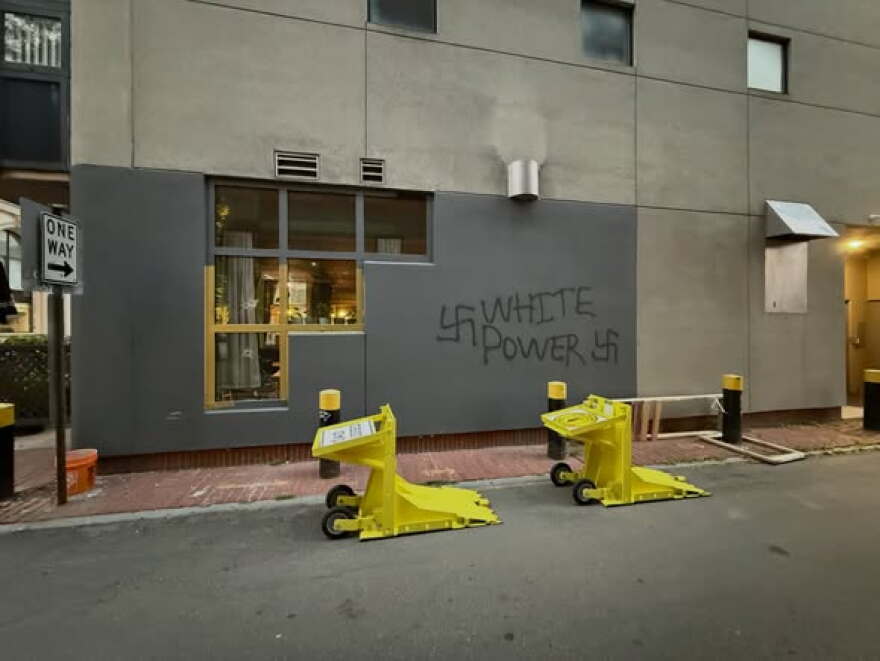 Vandals spray-painted white supremacist graffiti outside the Moka Pot coffee shop in Manchester early Wednesday.