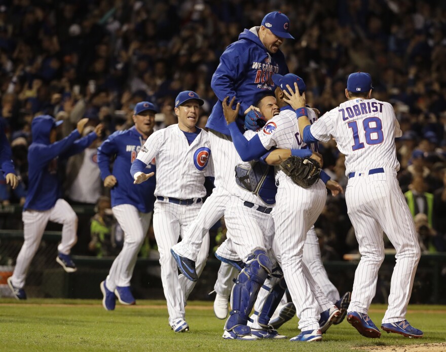 Chicago Cubs players celebrate after Game 6 of the National League baseball championship series against the Los Angeles Dodgers, Saturday, in Chicago.