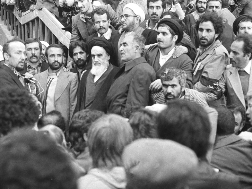 Ayatollah Ruhollah Khomeini is surrounded by followers after his arrival at Mehrabad Airport on Feb. 1,  1979, after 14 years of exile.