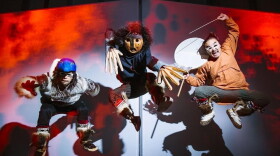 Phillip Blanchett, Stephen Blanchett and Ossie Kairaiuak dance in a performance by Pamyua.