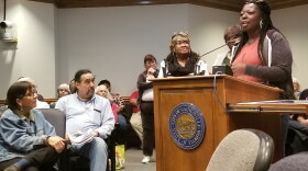 Crossing guard Pamela Miles explains to city commissions that crossing guards go beyond their job description to help the community. She said that one day, a boy came through her zone on a cold day without a jacket, so she found him one to warm himself.