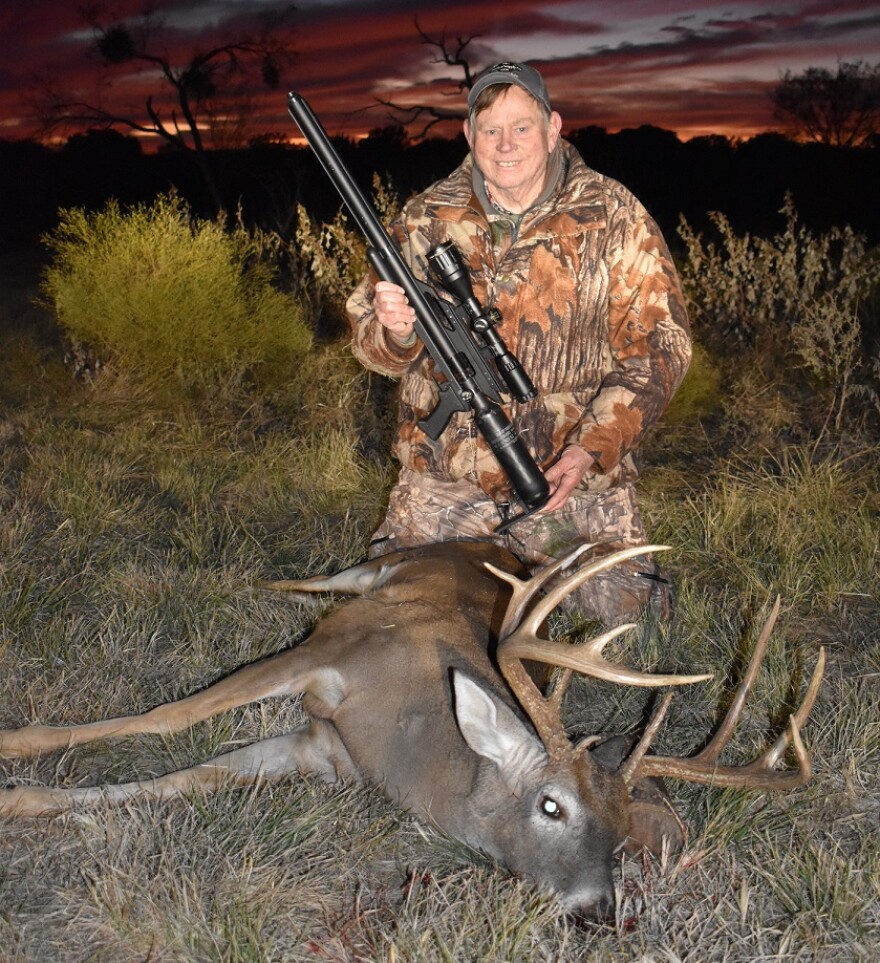 Luke with buck harvested with an airgun