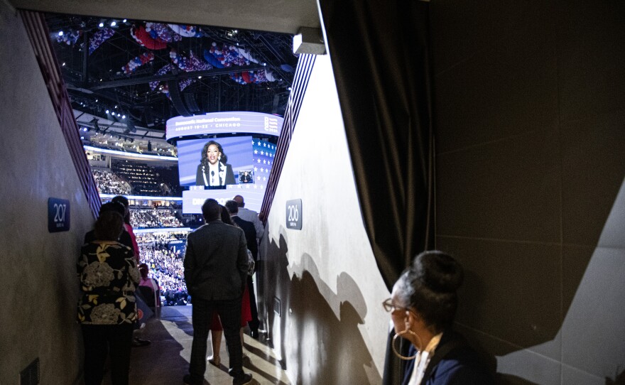 Delegates listen to U.S. Rep. Jasmine Crockett of Texas speak on the first night of the Democratic National Convention in Chicago, Illinois, on Monday, Aug. 19, 2024.