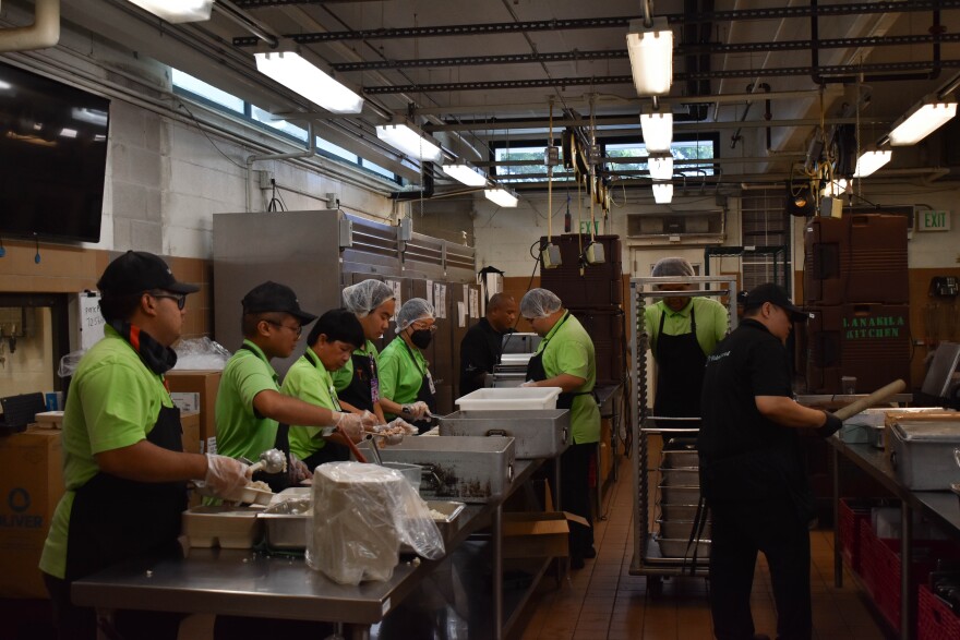 Kitchen staff at Lanakila Pacific cook meals.