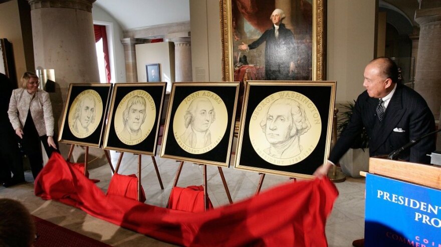 U.S. Mint Director Edmund Moy (right) and Director of the Federal Reserve's Division of Reserve Bank Operations and Payment Systems Louise Roseman (left) unveiled the designs of the presidential series of $1 coins during a ceremony at the Smithsonian National Portrait Gallery Nov. 20, 2006.