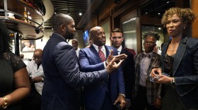U.S. Rep. Byron Donalds, R-Fla., left, and U.S. Rep. Wesley Hunt, R-Texas, second left, converse with host Sage Steele, right, before going onstage at a "Congress, cognac and cigars" Republican event on Wednesday, June 26, 2024, in Fairburn, Ga., ahead of a presidential debate between President Joe Biden and Republican presidential candidate former President Donald Trump.