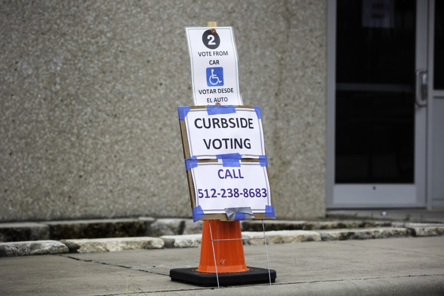 Curbside voting outside the Northwest Recreation Center voting location in Austin.