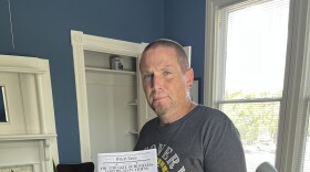 Michael Moss, Community Engagement Coordinator, with the first edition of the Athens Homeless Coalition's Street News.
