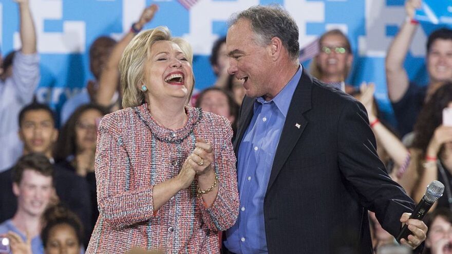 Democratic Presidential candidate Hillary Clinton and Sen. Tim Kaine laugh at a campaign rally in Annandale, Virginia, on July 14.