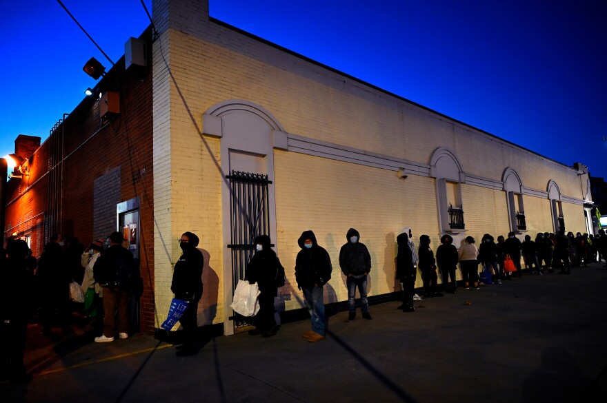On November 23, 2020 the line for the "La bodeguita de la gente" food pantry stretched along the building and didn't shorten until after dark as over 250 families were served with the makings for a full Thanksgiving dinner.