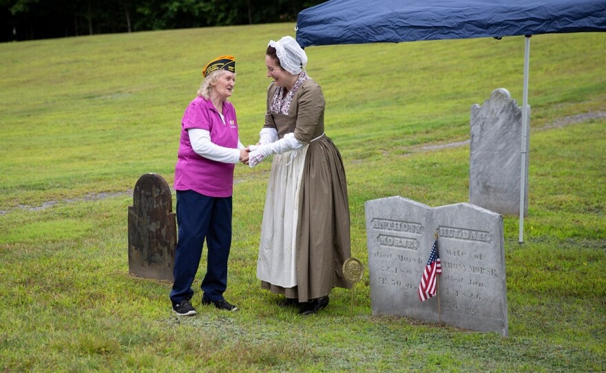 Doris Backus, left, of Sharon, Vt., shakes hands with Kristin Harris, Research Coordinator at the Boston Tea Party Ships & Museum, after placing a marker on the grave of Anthony Morse, a Boston Tea Party Participant, at Pine Hill Cemetery in Sharon, Vt., on Monday, Aug. 17, 2026. Backus, who is the cemetery's president and the fourth great granddaughter of Morse, helped to place the marker. "It meant a lot," Morse said of the experience. "I never thought I would've found something like this." (Valley News photo)