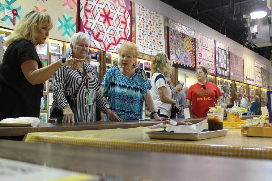 Contestants in one of the State Fair of Texas' cooking competitions look on as judges sample their dishes. Cooks competed in a citrus themed challenge and another inspired by fair foods in contests on October 9, 2019.