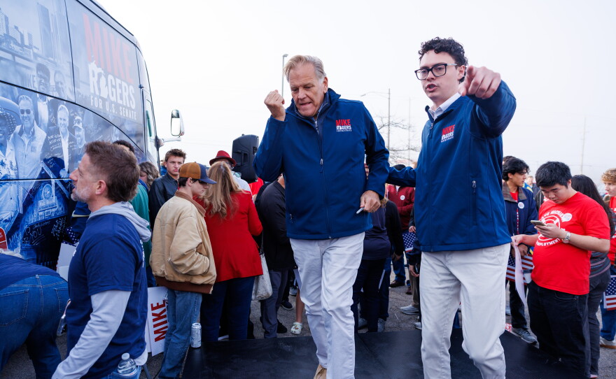 Republican U.S. Senate nominee Mike Rogers greets supporters in Lansing Township, Mich., on Oct. 24, 2026, during a stop on his "We Have a State to Save" bus tour.