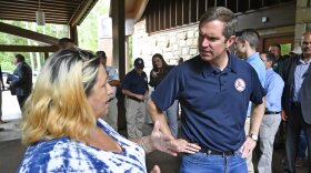 Kentucky Gov. Andy Beshear, right, speaks with Pansy McCoy at Jenny Wiley State Park in Prestonsburg, Ky., Tuesday, Sept. 6, 2022. Despite being a Democratic governor in a Republican dominated state, Beshear has a large amount of support from Kentucky residents. (AP Photo/Timothy D. Easley)
