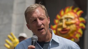 Billionaire environmental activist Tom Steyer, pictured here addressing the March to Break Free from Fossil Fuels in 2016 in Los Angeles, has launched an ad campaign seeking President Trump's impeachment. (David McNew/AFP/Getty Images)